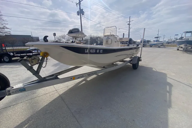 Slide: The Image of 2015 Carolina Skiff 20 JVX CC boat on trailer in outdoor setting. - 6
