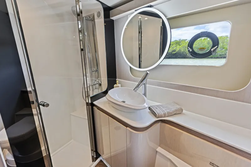 Slide: The Image of Luxurious bathroom in 2026 Cruisers 50 Fly yacht with modern fixtures and elegant design. - 34