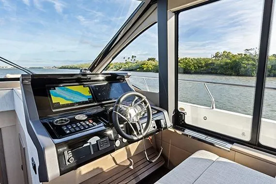 Slide: The Image of Helm of 2026 Cruisers 50 Fly yacht with modern navigation system. - 28