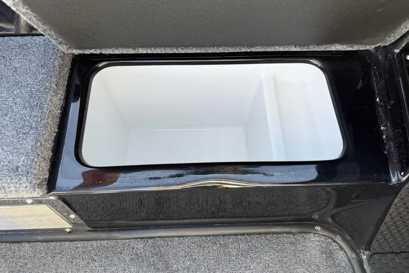 Slide: The Image of Open storage compartment in 2026 Phoenix 920 Elite X boat. - 13
