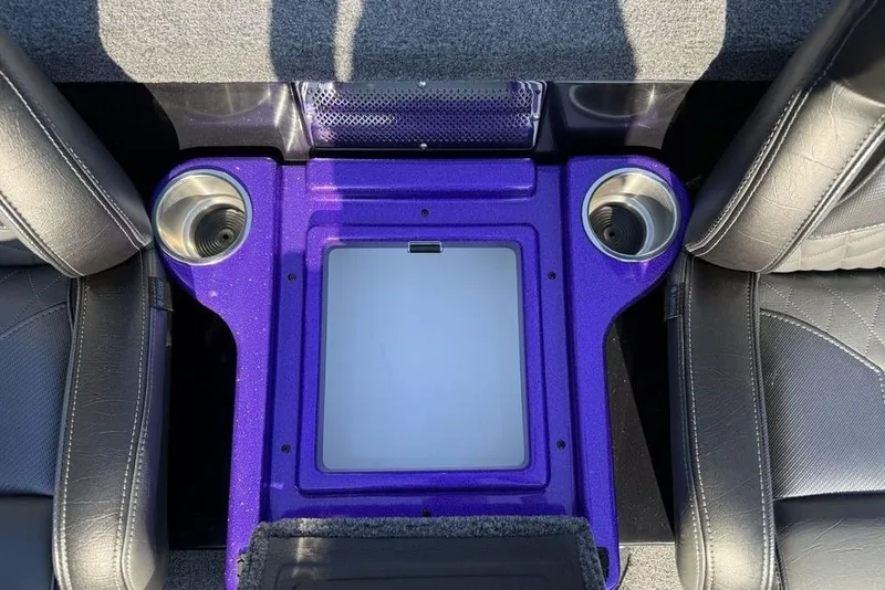 Slide: The Image of Interior of 2026 Phoenix 920 Elite X with purple console and cup holders. - 21