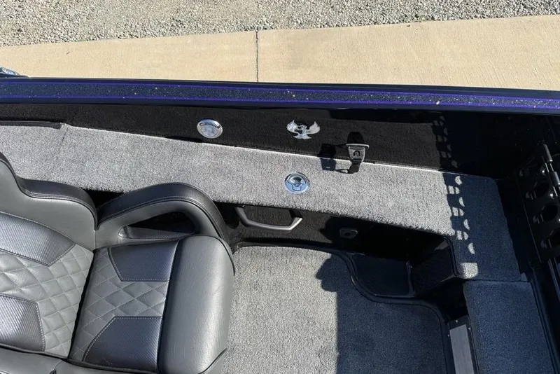 Slide: The Image of Interior of 2026 Phoenix 920 Elite X boat with gray seating and carpeted flooring. - 24