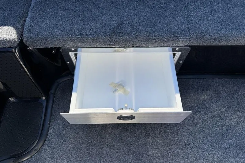 Slide: The Image of Open storage drawer in 2026 Phoenix 920 Elite X boat interior. - 25