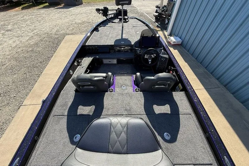 Slide: The Image of 2026 Phoenix 920 Elite X boat interior with dual seats and advanced dashboard. - 26