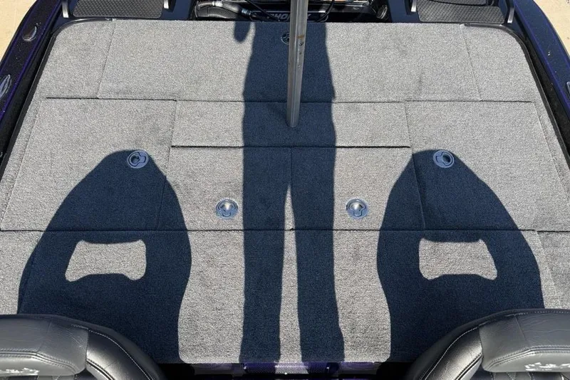 Slide: The Image of Rear deck of 2026 Phoenix 920 Elite X boat with carpeted surface and storage compartments. - 27