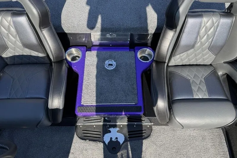 Slide: The Image of Interior of 2026 Phoenix 920 Elite X boat with dual seats and cup holders. - 9