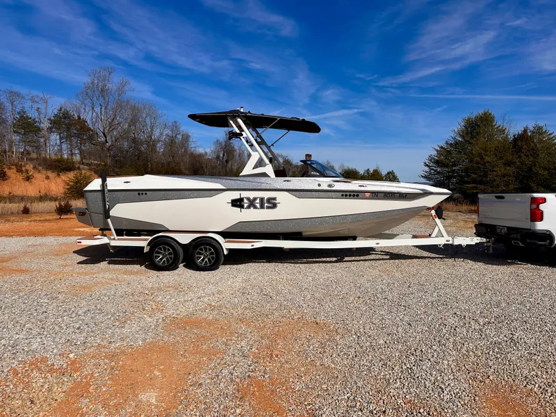The Image of 2023 Axis Wake Research A24 boat on trailer outdoors. - 0