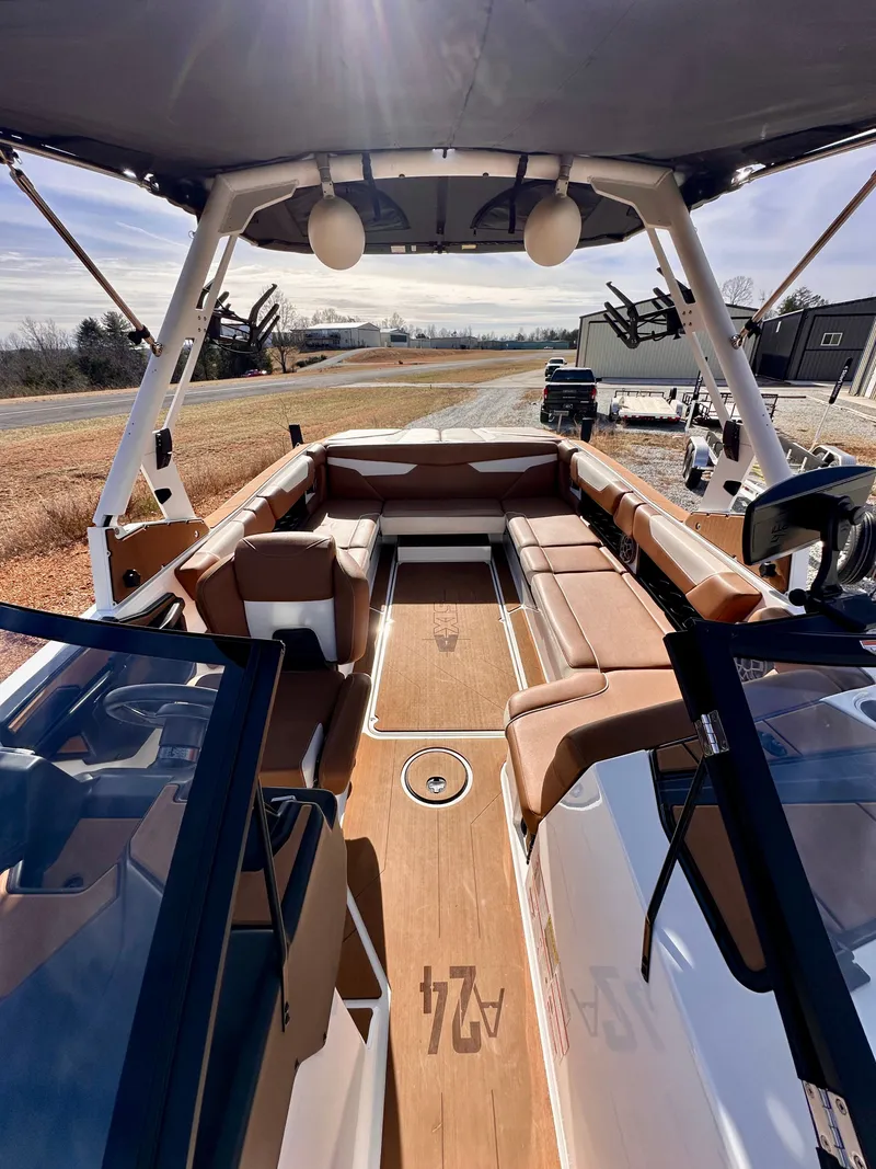Slide: The Image of Interior of a 2023 Axis Wake Research A24 boat with brown seating. - 13