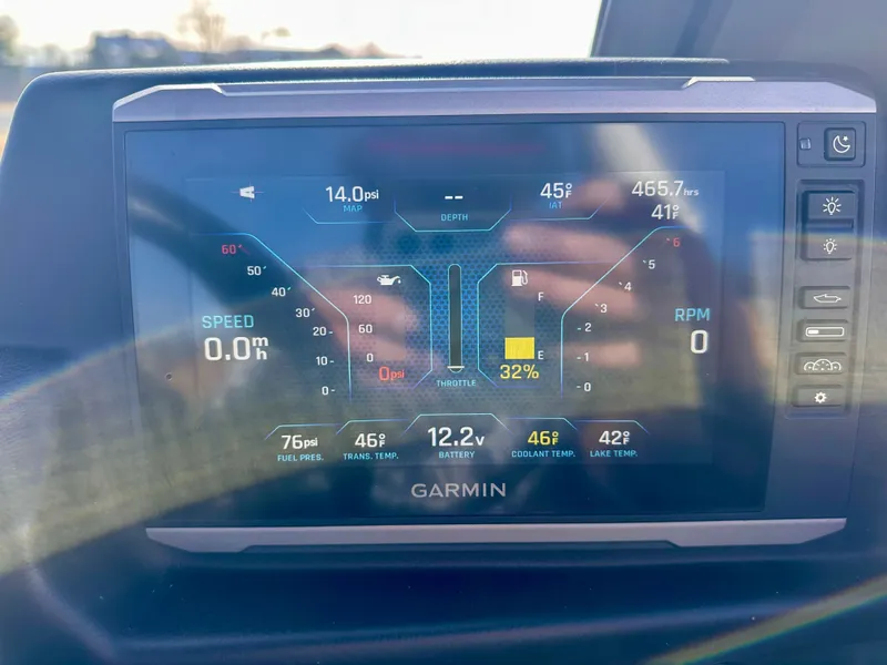 Slide: The Image of Garmin display on 2023 Axis A24 boat showing engine metrics. - 16
