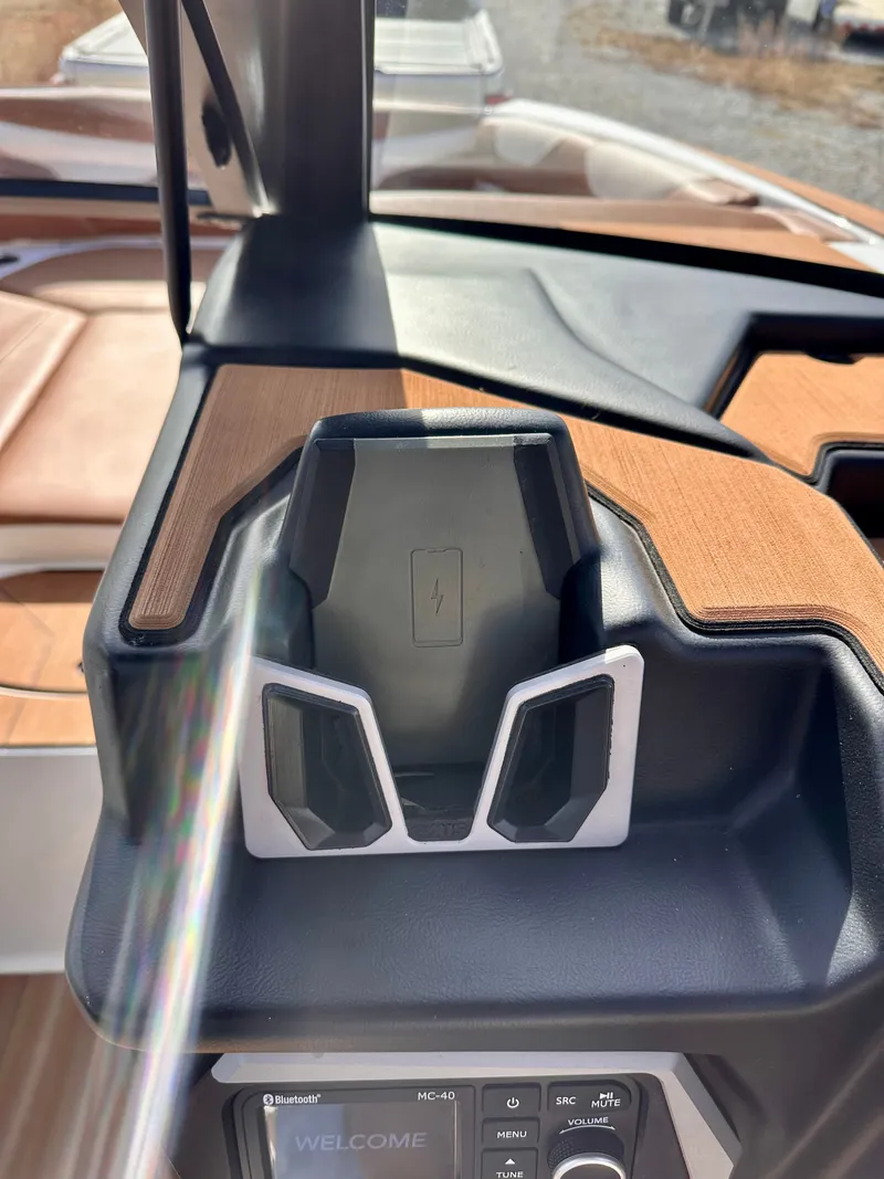 Slide: The Image of 2023 Axis Wake Research A24 boat dashboard with charger. - 17