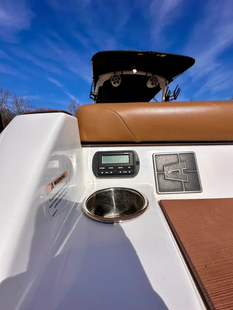 Slide: The Image of 2023 Axis Wake Research A24 boat interior with control panel. - 23