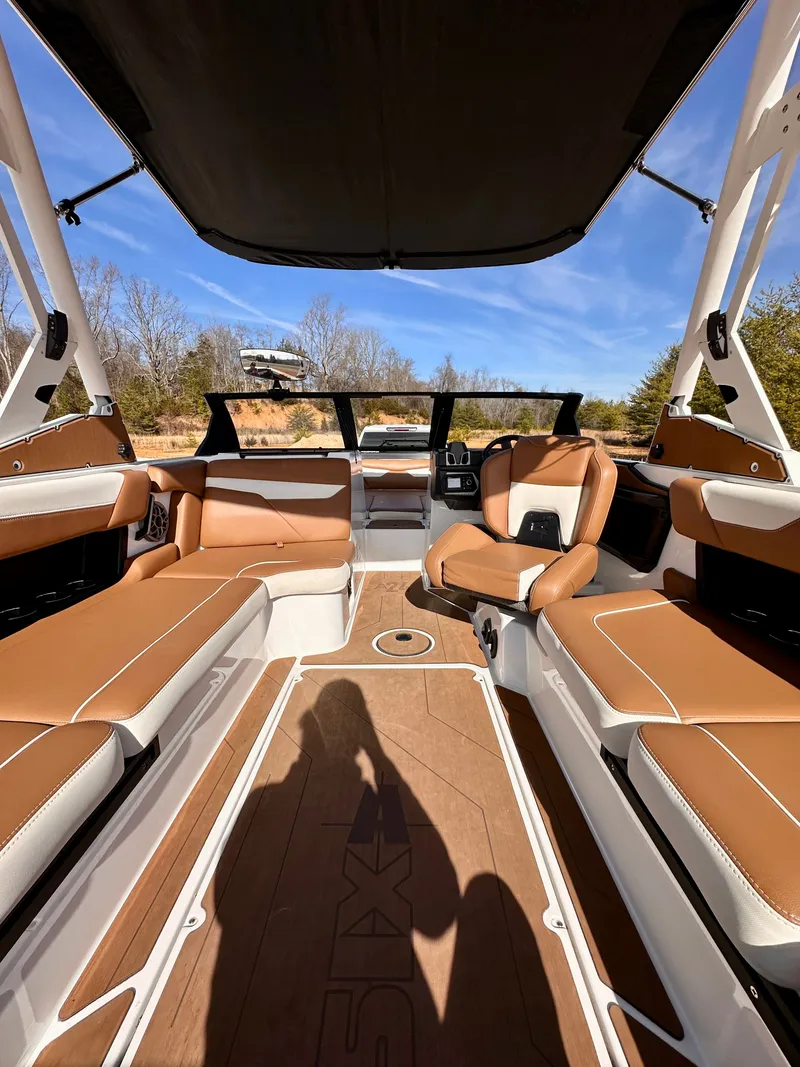 Slide: The Image of 2023 Axis Wake Research A24 boat interior with tan seating. - 8