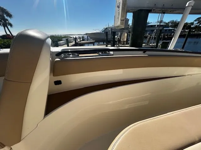 Slide: The Image of Interior view of a 2022 Scout 305 LXF boat at the dock. - 15