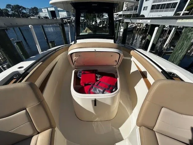 Slide: The Image of Scout 305 LXF 2022 with open storage and seating area. - 16