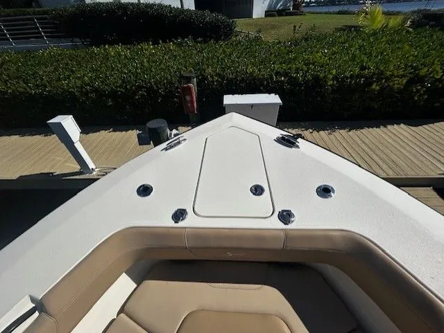 Slide: The Image of Scout 305 LXF 2022 boat bow view at dock. - 21