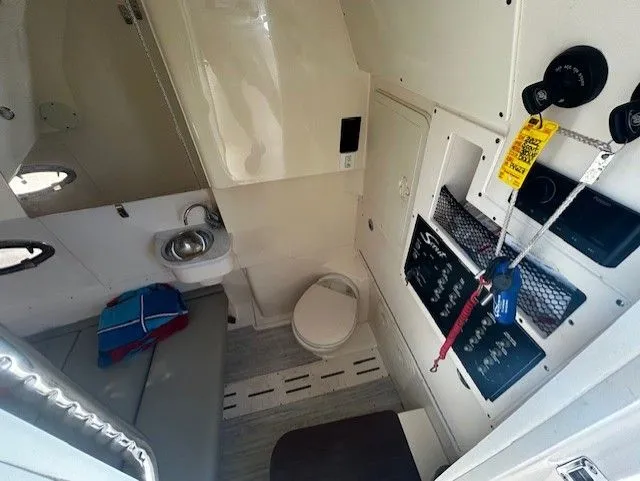 Slide: The Image of Interior of 2022 Scout 305 LXF with toilet and seating area. - 26