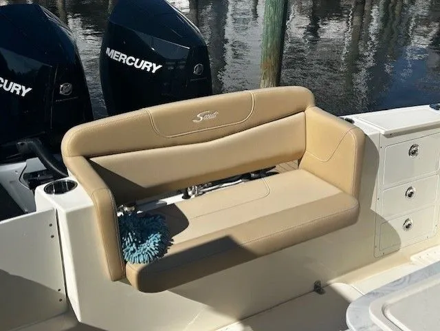 Slide: The Image of Scout 305 LXF 2022 with beige seating and Mercury engines. - 35