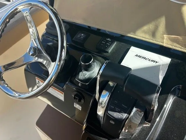 Slide: The Image of Control console of a 2022 Scout 305 LXF boat. - 36