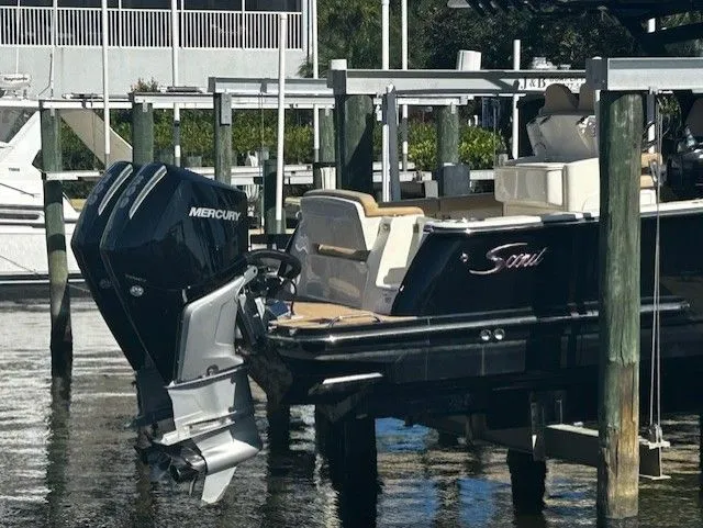 Slide: The Image of 2022 Scout 305 LXF boat with Mercury outboard motor. - 4