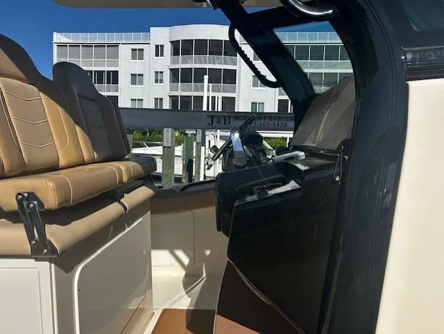 Slide: The Image of Interior of a 2022 Scout 305 LXF boat with modern seating. - 40