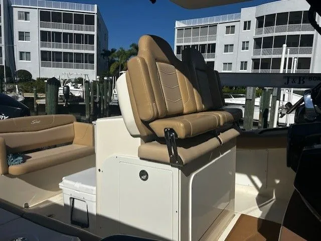 Slide: The Image of Interior of a 2022 Scout 305 LXF boat with beige seating. - 41
