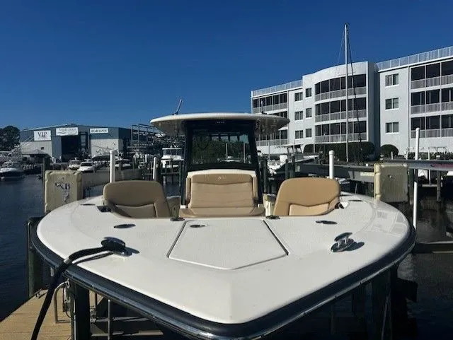 Slide: The Image of Scout 305 LXF 2022 boat docked, modern design. - 42