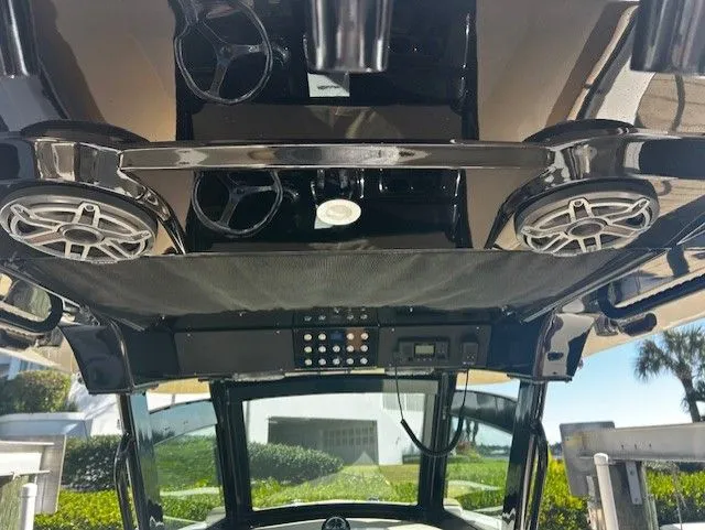 Slide: The Image of Interior view of a 2022 Scout 305 LXF boat with speakers. - 6