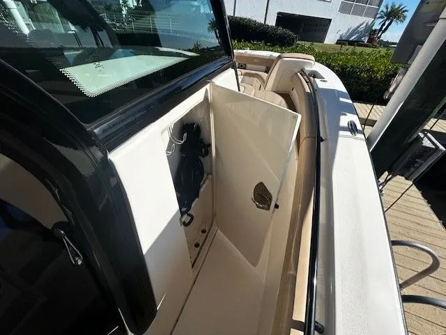 Slide: The Image of Scout 305 LXF 2022 with open storage compartment on deck. - 7