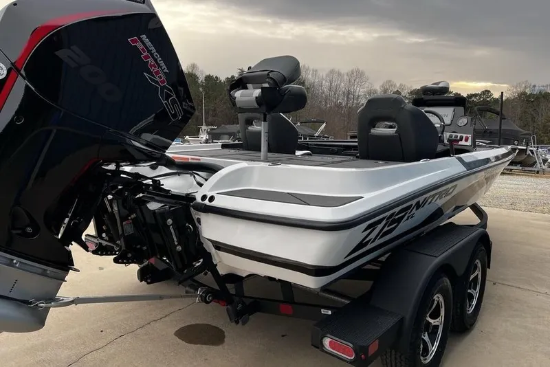 Slide: The Image of 2026 Nitro Z19 XL Pro boat with Mercury Pro XS engine, parked on a trailer. - 11