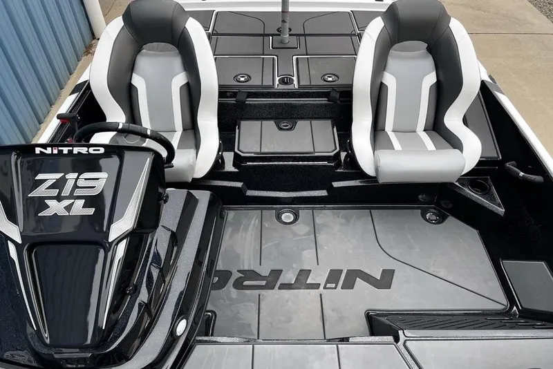 Slide: The Image of 2026 Nitro Z19 XL Pro boat interior with dual seats and steering console. - 15