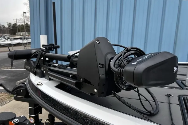 Slide: The Image of 2026 Nitro Z19 XL Pro boat with Garmin equipment, docked near a blue building. - 19