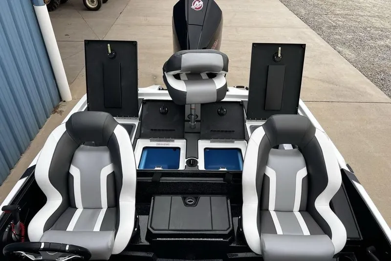 Slide: The Image of 2026 Nitro Z19 XL Pro boat interior with gray and white seats, storage compartments, and steering wheel. - 22