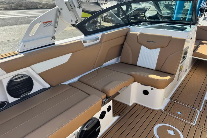 Slide: The Image of 2026 MasterCraft XT24 boat interior with tan and white seating, featuring modern design and premium materials. - 10
