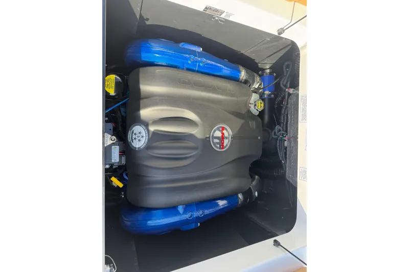 Slide: The Image of 2026 MasterCraft XT24 engine compartment with Ilmor branding, featuring blue and black components. - 15
