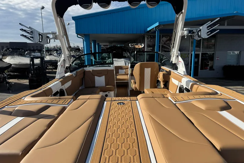Slide: The Image of 2026 MasterCraft XT24 boat interior with tan seating and modern design. - 8