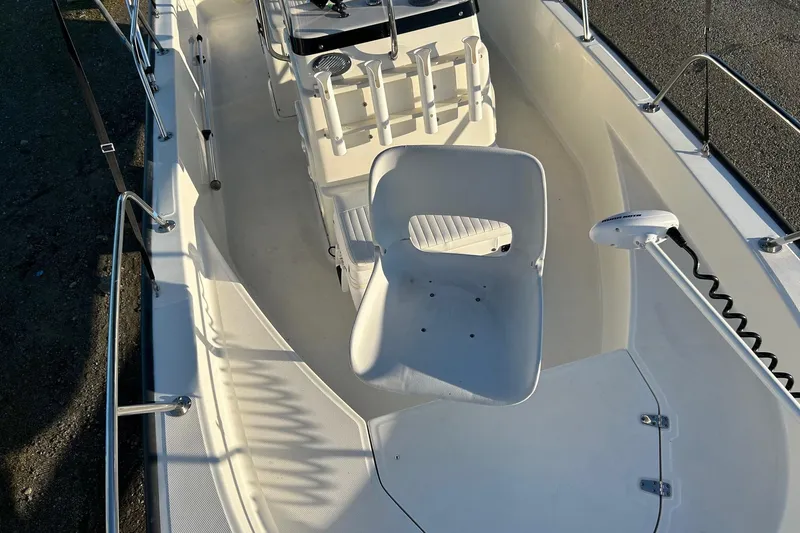 Slide: The Image of 2015 Boston Whaler 170 Montauk boat interior with seating and console. - 19