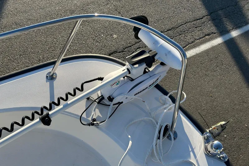 Slide: The Image of 2015 Boston Whaler 170 Montauk bow with trolling motor and railing. - 21