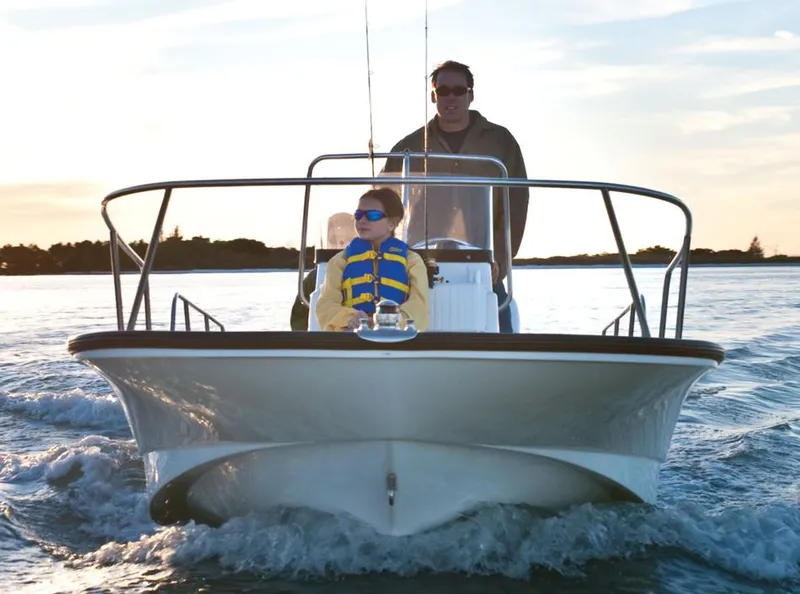 Slide: The Image of Manufacturer Provided Image: 2015 Boston Whaler 170 Montauk boat on water with two passengers. - 3