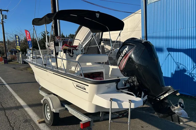 Slide: The Image of 2015 Boston Whaler 170 Montauk boat with Mercury engine on trailer. - 4