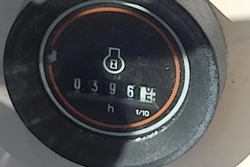 Slide: The Image of Hour meter reading 396.5 on 1999 Grady-White Escape 209 boat. - 22