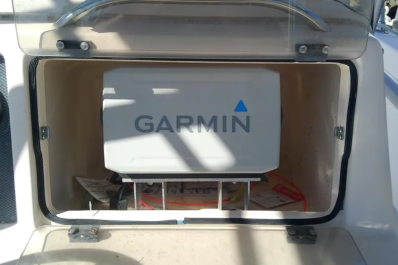 Slide: The Image of Garmin device in storage compartment of 1999 Grady-White Escape 209 boat. - 23