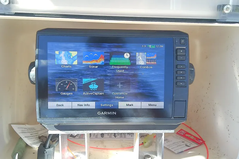Slide: The Image of Garmin marine GPS display on 1999 Grady-White Escape 209 boat dashboard. - 24
