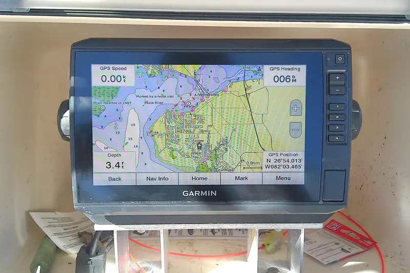 Slide: The Image of Garmin GPS display on 1999 Grady-White Escape 209 boat, showing navigation map and data. - 25