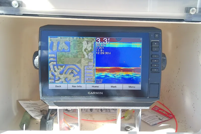 Slide: The Image of Garmin navigation system on 1999 Grady-White Escape 209 boat dashboard. - 26