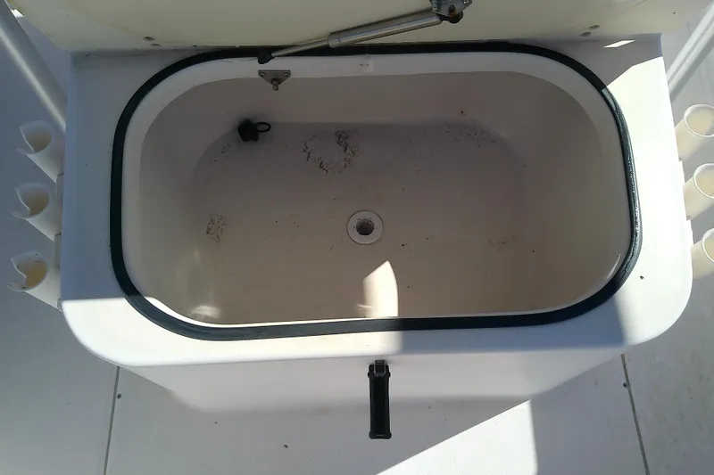 Slide: The Image of Livewell compartment on a 1999 Grady-White Escape 209 boat, open and empty. - 29