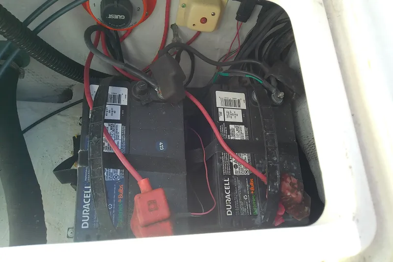 Slide: The Image of Battery compartment of 1999 Grady-White Escape 209 boat with Duracell batteries. - 30