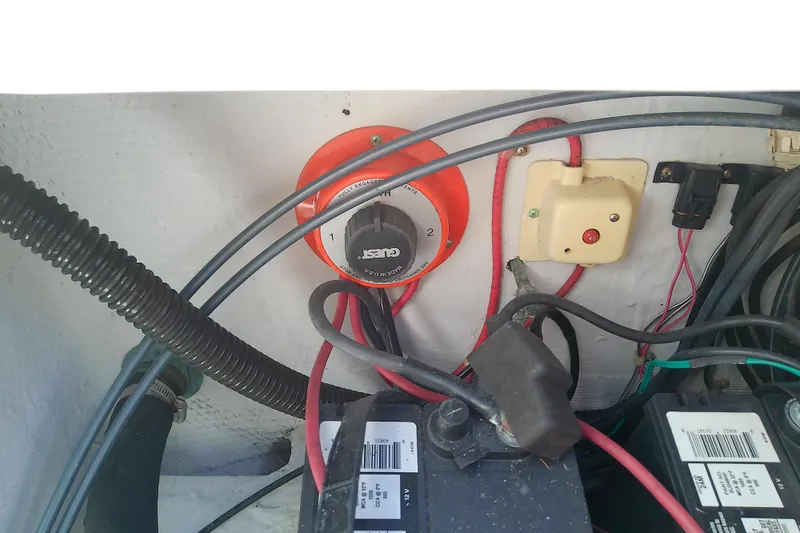 Slide: The Image of Electrical wiring and battery setup in a 1999 Grady-White Escape 209 boat. - 31