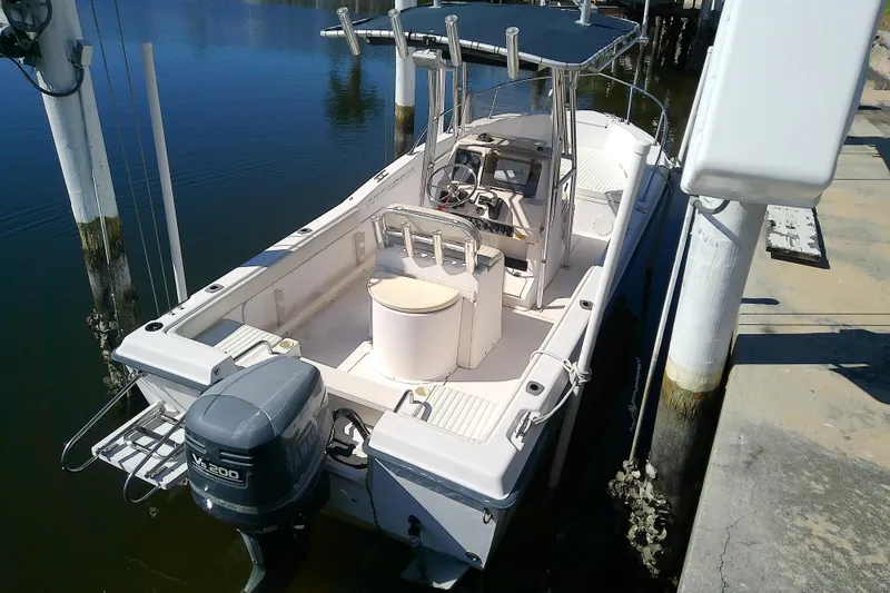 Slide: The Image of 1999 Grady-White Escape 209 boat docked with Yamaha V6 engine. - 7