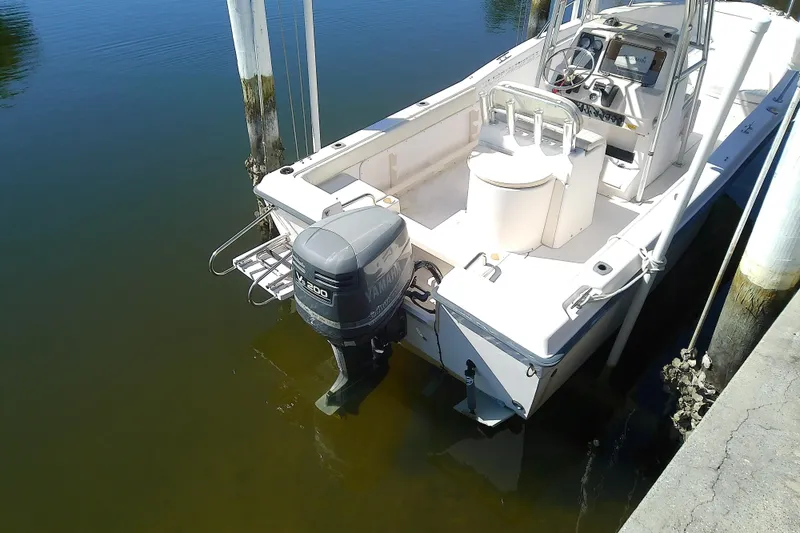 Slide: The Image of 1999 Grady-White Escape 209 boat docked with Yamaha outboard motor. - 8