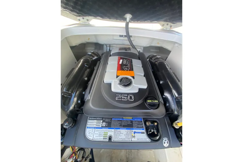 Slide: The Image of Engine compartment of 2017 Chaparral 227 SSX boat, featuring a 4.5L 250 horsepower engine. - 14